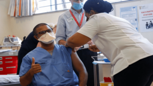 A healthcare worker receives the Johnson & Johnson vaccine at Khayelitsha hospital in Cape Town [Mike Hutchings/Reuters]